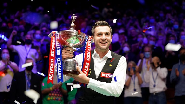 Mark Selby of England celebrates with the trophy following his victory during the Final between Shaun Murphy and Mark Selby on day seventeen of the Betfred World Snooker Championship at the Crucible Theatre on May 3, 2021 in Sheffield, England. (Photo by Zac Goodwin - Pool/Getty Images)