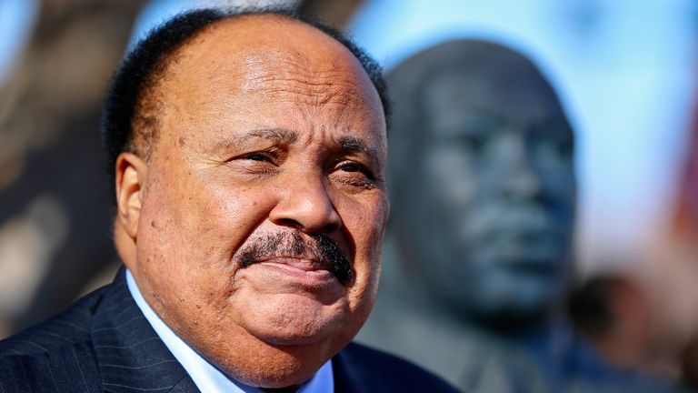 Martin Luther King III stands next to a bust of his father, the Rev. Martin Luther King Jr., during a wreath laying ceremony in 2018 (Pic: The Topeka Capital-Journal via AP)