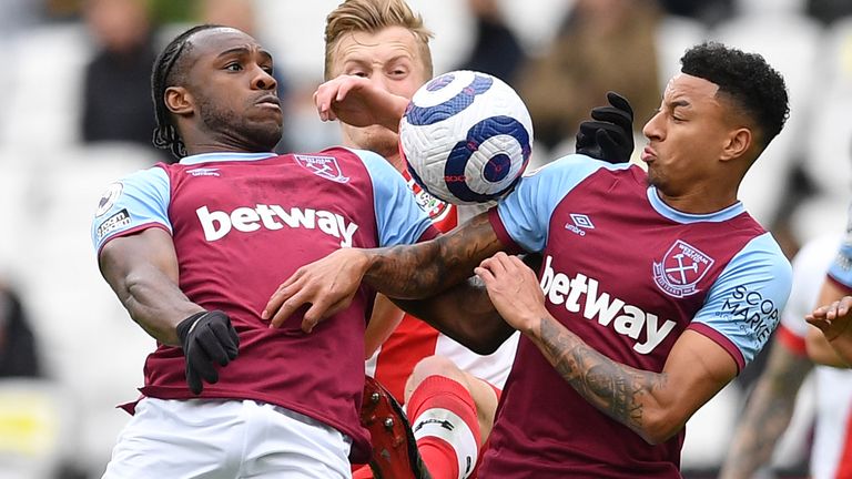 West Ham's Michail Antonio and Jesse Lingard both go for the ball (AP)