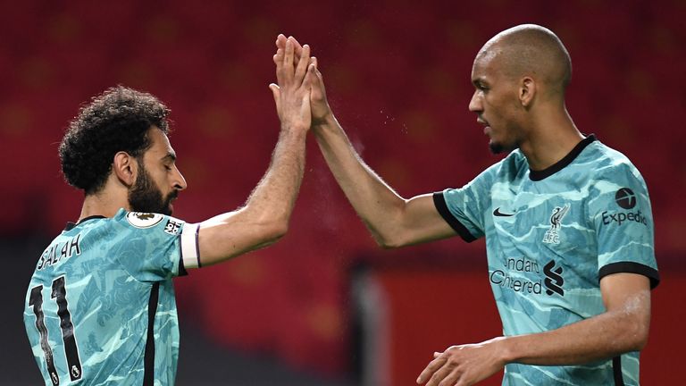 Liverpool's Mohamed Salah celebrates scoring the fourth goal at Manchester United with Fabinho 