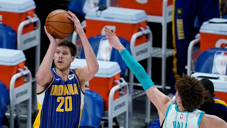 Indiana Pacers&#39; Doug McDermott (20) shoots against Charlotte Hornets&#39; LaMelo Ball (2) during the first half of an NBA basketball Eastern Conference play-in game Tuesday, May 18, 2021, in Indianapolis. (AP Photo/Darron Cummings)


