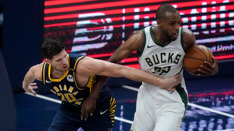 Milwaukee Bucks&#39; Khris Middleton (22) gets a rebound against Indiana Pacers&#39; Doug McDermott (20) during the second half of an NBA basketball game Thursday, May 13, 2021, in Indianapolis.