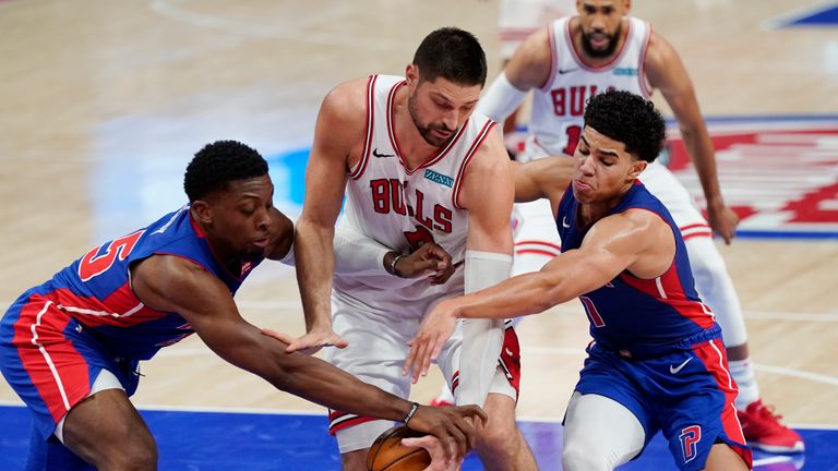 Detroit Pistons forward Tyler Cook, left, and guard Killian Hayes, right, reach in on Chicago Bulls center Nikola Vucevic during the second half of an NBA basketball game, Sunday, May 9, 2021, in Detroit. (AP Photo/Carlos Osorio)


