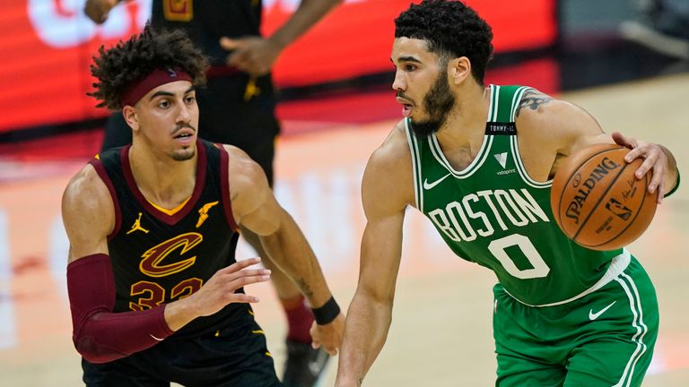 Boston Celtics&#39; Jayson Tatum (0) drives against Cleveland Cavaliers&#39; Brodric Thomas (33) in the first half of an NBA basketball game, Wednesday, May 12, 2021, in Cleveland.