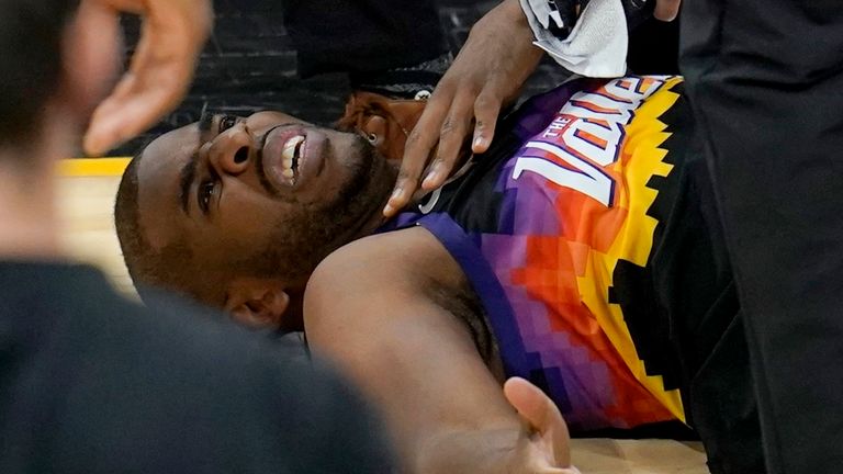 Chris Paul grimaces on the floor following his shoulder injury in Game 1 against the Los Angeles Lakers