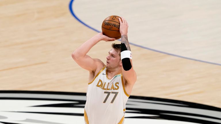 Dallas Mavericks&#39; Luka Doncic attempts a three-point basket during the first half of an NBA basketball game against the Brooklyn Nets in Dallas, Thursday, May 6, 2021. (AP Photo/Tony Gutierrez)


