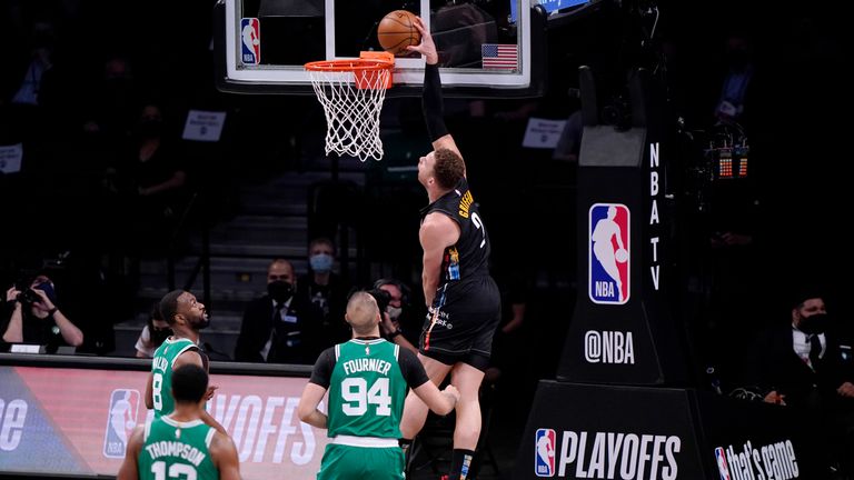 Brooklyn Nets forward Blake Griffin (2) dunks in front of three Boston Celtics defenders during the first quarter of Game 2 of an NBA basketball first-round playoff series Tuesday, May 25, 2021, in New York. (AP Photo/Kathy Willens)


