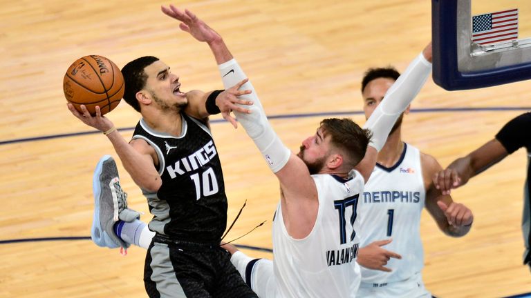 Sacramento Kings guard Justin James (10) shoots against Memphis Grizzlies center Jonas Valanciunas (17) in the second half of an NBA basketball game Thursday, May 13, 2021, in Memphis, Tenn.