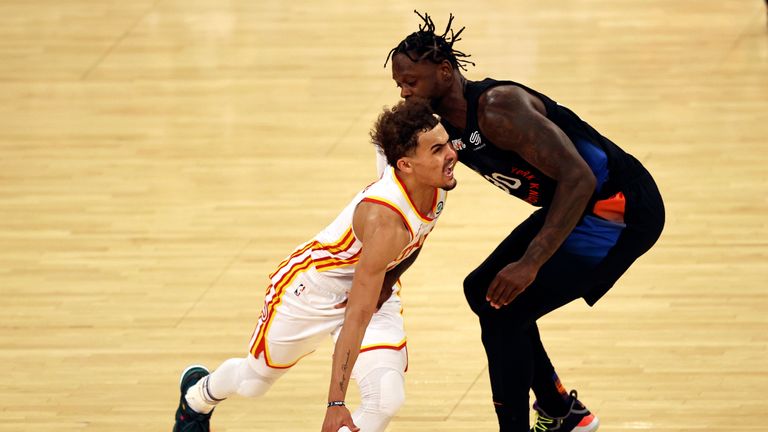 Atlanta Hawks&#39; Trae Young, left, drives past New York Knicks&#39; Julius Randle in the third quarter of Game 2 in an NBA basketball first-round playoff series Wednesday, May 26, 2021, in New York. (Elsa/Pool Photo via AP)


