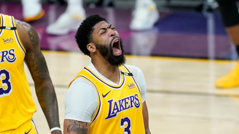 Los Angeles Lakers forward Anthony Davis shouts as he celebrates a stop against the Phoenix Suns during the second half of Game 2 of an NBA basketball first-round playoff series Tuesday, May 25, 2021, in Phoenix. The Lakers defeated the Suns 109-102. (AP Photo/Ross D. Franklin)


