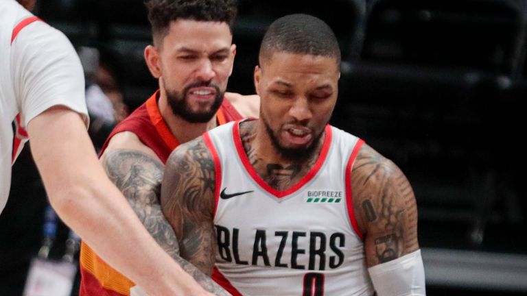 Portland Trail Blazers center Jusuf Nurkic (27) sets a screen against Denver Nuggets guard Austin Rivers as Rivers fouls Trail Blazers guard Damian Lillard (0) in the second quarter of Game 2 of a first-round NBA basketball playoff series Monday, May 24, 2021, in Denver. 