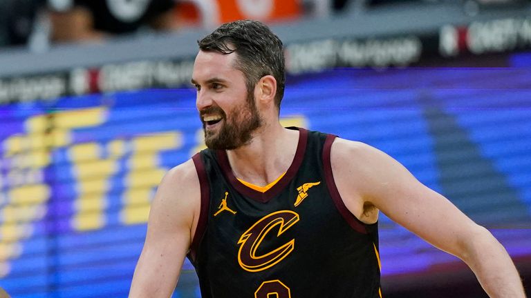 Cleveland Cavaliers&#39; Kevin Love, right, celebrates with Collin Sexton after Sexton scored during the second half of the team&#39;s NBA basketball game against the Boston Celtics, Wednesday, May 12, 2021, in Cleveland. The Cavaliers won 102-94.