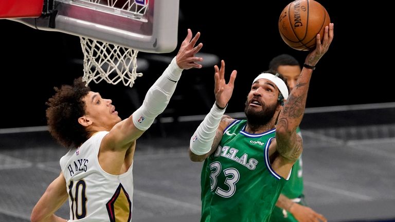 New Orleans Pelicans center Jaxson Hayes (10) defends as Dallas Mavericks center Willie Cauley-Stein (33) shoots during the first half of an NBA basketball game in Dallas, Wednesday, May 12, 2021. 