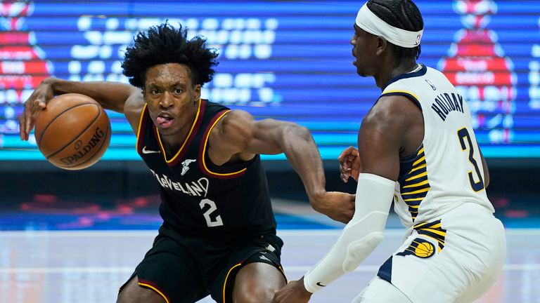 Cleveland Cavaliers&#39; Collin Sexton (2) drives against Indiana Pacers&#39; Aaron Holiday (3) in the first half of an NBA basketball game, Monday, May 10, 2021, in Cleveland.