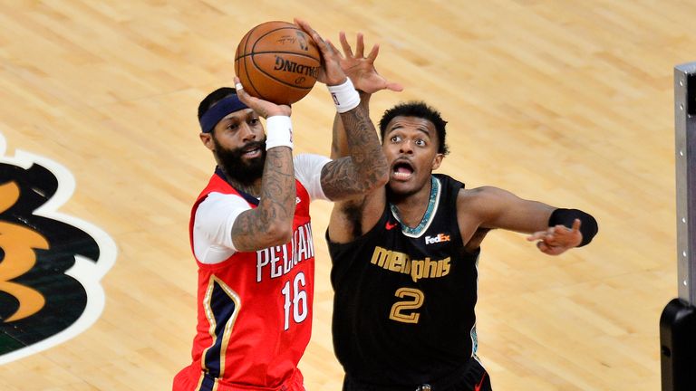 New Orleans Pelicans forward James Johnson (16) shoots against Memphis Grizzlies center Xavier Tillman (2) in the second half of an NBA basketball game Monday, May 10, 2021, in Memphis, Tenn.