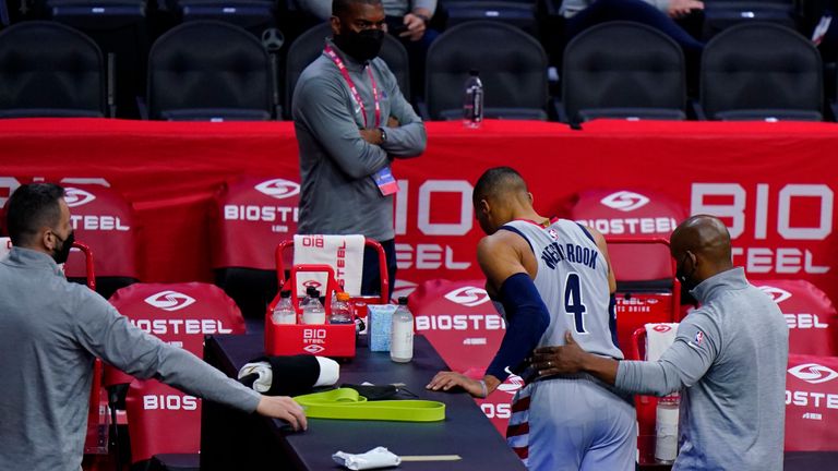 Washington Wizards&#39; Russell Westbrook (4) is helped to the locker room after an injury during the second half of Game 2 in a first-round NBA basketball playoff series against the Philadelphia 76ers, Wednesday, May 26, 2021, in Philadelphia. (AP Photo/Matt Slocum)


