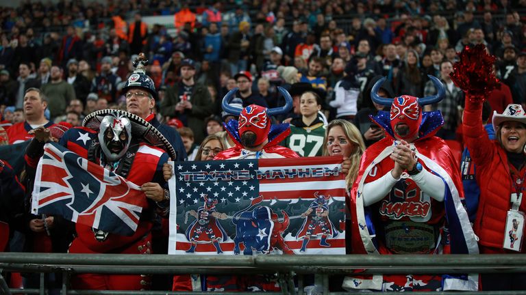 NFL fans watch teams play between the Houston Texans and the Jacksonville Jaguars during the second half of an NFL football game at Wembley Stadium, Sunday, Nov. 3, 2019, in London. (AP Photo/Ian Walton)