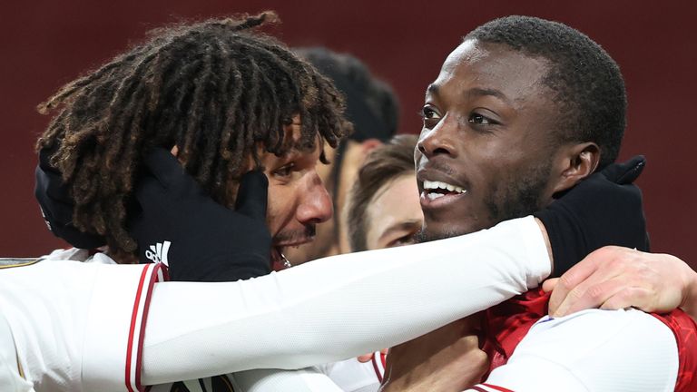 LONDON, ENGLAND - APRIL 08: Nicolas Pepe of Arsenal celebrates with Mohamed Elneny of Arsenal after scoring their 1st goal during the UEFA Europa League Quarter Final First Leg match between Arsenal FC and Slavia Praha at Emirates Stadium on April 8, 2021 in London, United Kingdom. Sporting stadiums around Europe remain under strict restrictions due to the Coronavirus Pandemic as Government social distancing laws prohibit fans inside venues resulting in games being played behind closed doors. (Photo by Charlotte Wilson/Offside/Offside via Getty Images)