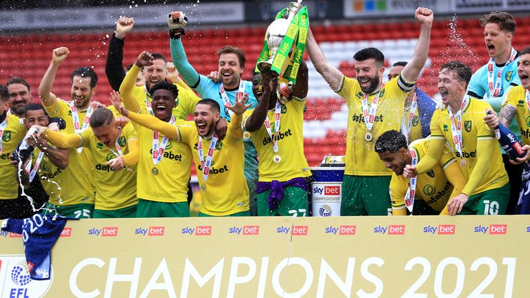 Norwich City celebrate with the trophy after the Sky Bet Championship match at Oakwell Stadium