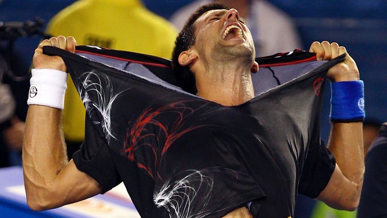 Novak Djokovic of Serbia celebrates after defeating Rafael Nadal of Spain during the men's singles final at the Australian Open tennis championship, in Melbourne, Australia, early Monday, Jan. 30, 2012. (AP Photo/Rick Rycroft)