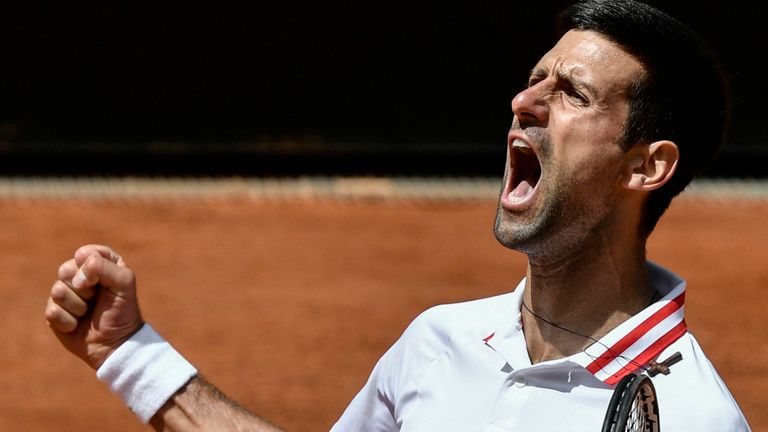 Novak Djokovic celebrates winning the second set against Greece's Stefanos Tsitsipas during their quarter final match of the Men's Italian Open at Foro Italico on May 15, 2021 in Rome, Italy. (Photo by Filippo MONTEFORTE / AFP) (Photo by FILIPPO MONTEFORTE/AFP via Getty Images)