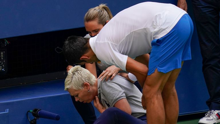 Novak Djokovic, of Serbia, checks a linesman after hitting her with a ball in reaction to losing a point to Pablo Carreno Busta, of Spain, during the fourth round of the U.S. Open tennis championships in New York, in this Sunday, Sept. 6, 2020, file photo. 