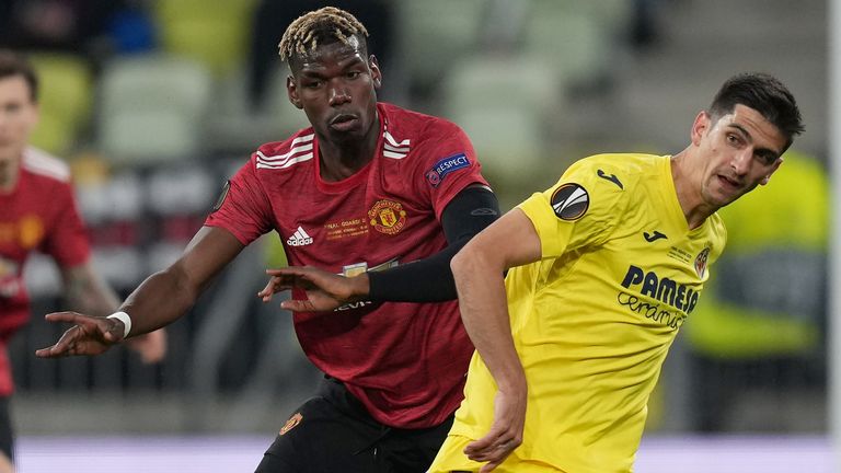 Manchester United midfielder Paul Pogba battles for possession with Gerard Moreno of Villarreal CF 