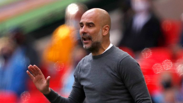 Manchester City&#39;s head coach Pep Guardiola gestures during the English League Cup final soccer match between Manchester City and Tottenham Hotspur at Wembley stadium in London, Sunday, April 25, 2021.