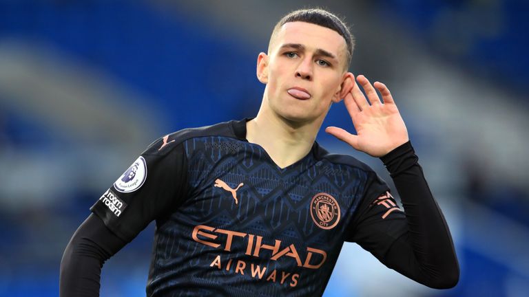 Phil Foden cups his ear in celebration