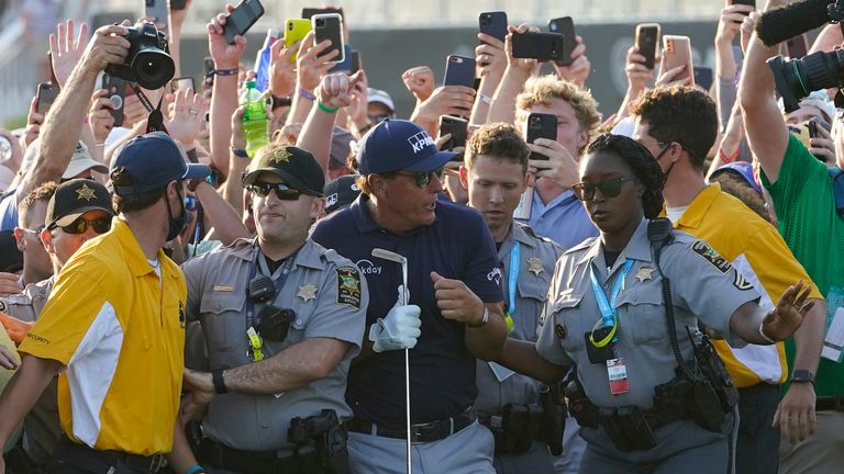 Phil Mickelson wades through fans on the 18th fairway during the final round at the PGA Championship golf tournament on the Ocean Course, Sunday, May 23, 2021, in Kiawah Island, S.C. (AP Photo/Matt York)