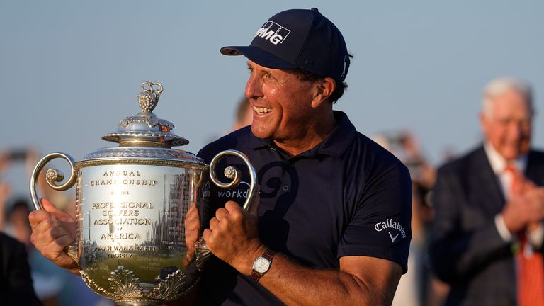 Phil Mickelson holds the Wanamaker Trophy after winning the final round at the PGA Championship golf tournament on the Ocean Course, Sunday, May 23, 2021, in Kiawah Island, S.C. (AP Photo/David J. Phillip)