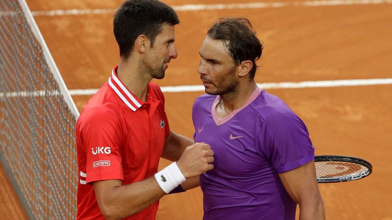 Spain's Rafael Nadal, right, greets Serbia's Novak Djokovic after deleting him at their final match of the Italian Open tennis tournament, in Rome, Sunday, May 16, 2021. Nadal won 7-5, 1-6, 6-3. (AP Photo/Gregorio Borgia)