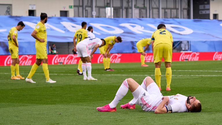 Karim Benzema lays crestfallen after Real Madrid's title hopes go up in smoke                               