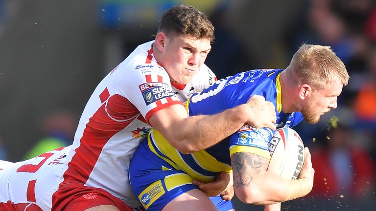 Warrington Wolves' Mike Cooper is tackled by Hull Kingston Rovers' Robbie Mulher  and Mose Masoe during the Betfred Super League match at the Halliwell Jones Stadium, Warrington. PRESS ASSOCIATION Photo. Picture date: Saturday February 9, 2019. See PA story RUGBYL Warrington. Photo credit should read: Dave Howarth/PA Wire. RESTRICTIONS: Editorial use only. No commercial use. No false commercial association. No video emulation. No manipulation of images.  
