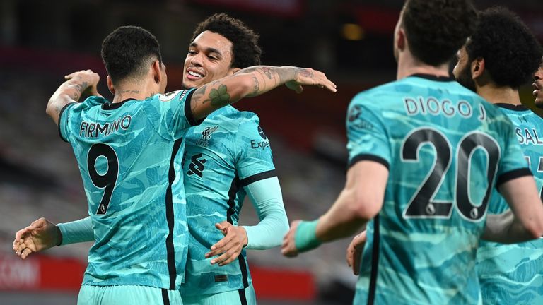 Roberto Firmino celebrates with Trent Alexander-Arnold after putting Liverpool 3-1 up at Old Trafford