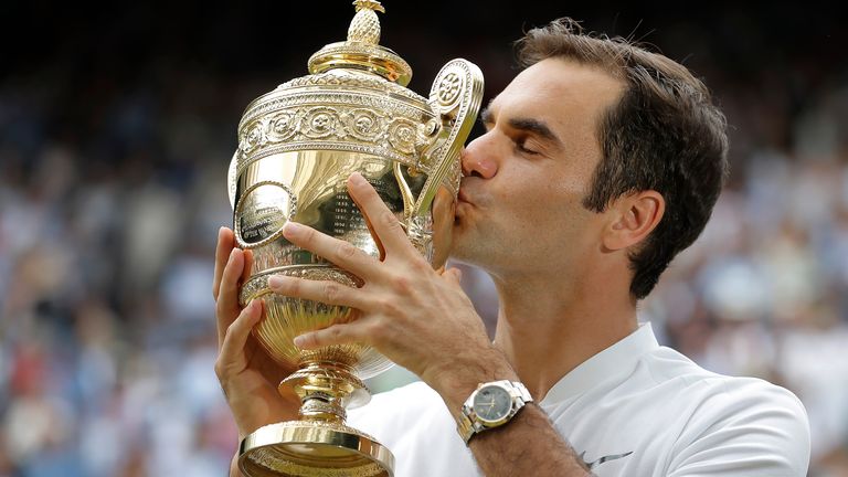 Roger Federer kisses the trophy after winning the men&#39;s singles final against Marin Cilic on Centre Court on day thirteen of the 2017 Wimbledon tennis championships at the All England Lawn Tennis Club on July 16th 2017 in London (Photo by Tom Jenkins/Getty Images)