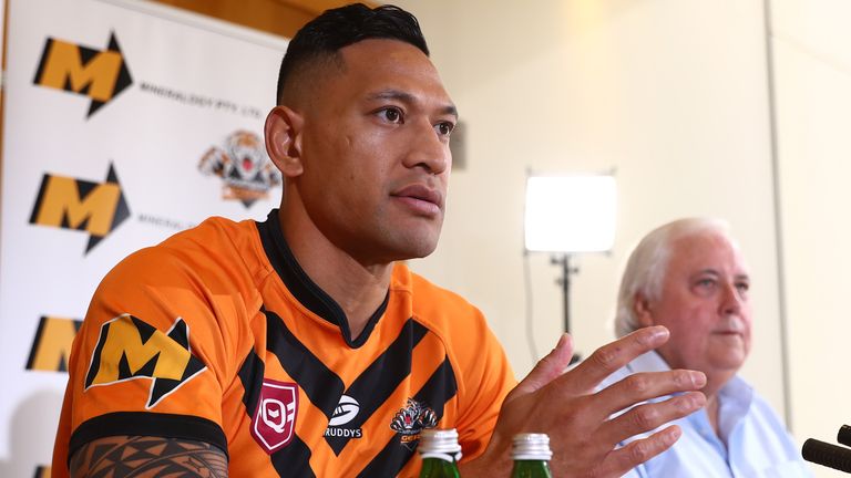 Israel Folau at a press conference with Clive Palmer after signing for Southport Tigers  