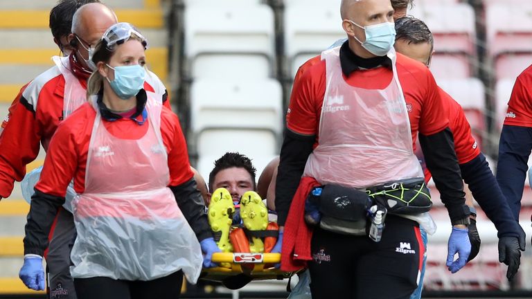 James Bentley is stretchered off against suffering a broken leg against Leigh