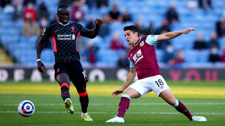 Burnley's Ashley Westwood (right) and Liverpool's Sadio Mane (left) battle for the ball