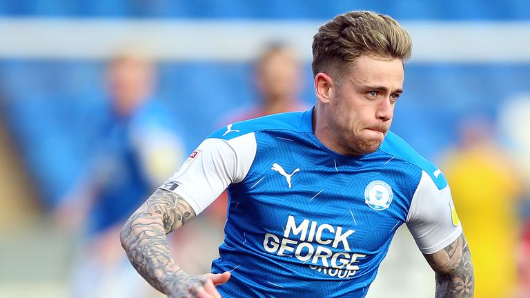 PA - Sam Szmodics in action for Peterborough