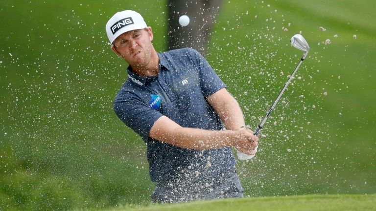 Seamus Power, of Ireland, hits out of a bunker onto the ninth green during the final round of the AT&T Byron Nelson golf tournament in McKinney, Texas, Sunday, May 16, 2021. (AP Photo/Ray Carlin)