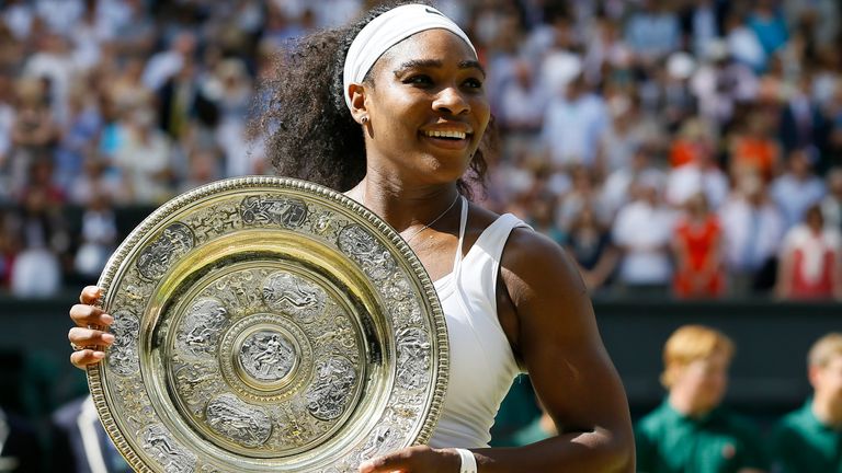 Serena Williams of the United States holds up the trophy after winning the women's singles final against Garbine Muguruza of Spain, at the All England Lawn Tennis Championships in Wimbledon, London. Williams won 6-4, 6-4. (AP Photo/Kirsty Wigglesworth, File)