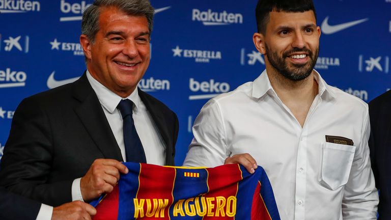FC Barcelona president Joan Laporta, left, and Argentinian forward Sergio 'Kun' Aguero pose for the media during the official presentation of Aguero after signing for FC Barcelona in Barcelona, Spain, Monday May. 31, 2021. (AP Photo/Joan Monfort)


