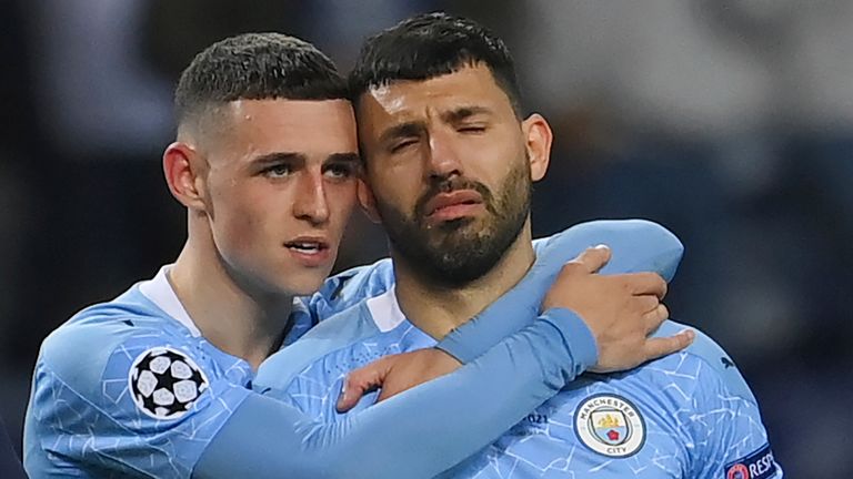 Sergio Aguero is consoled by Phil Foden in Porto