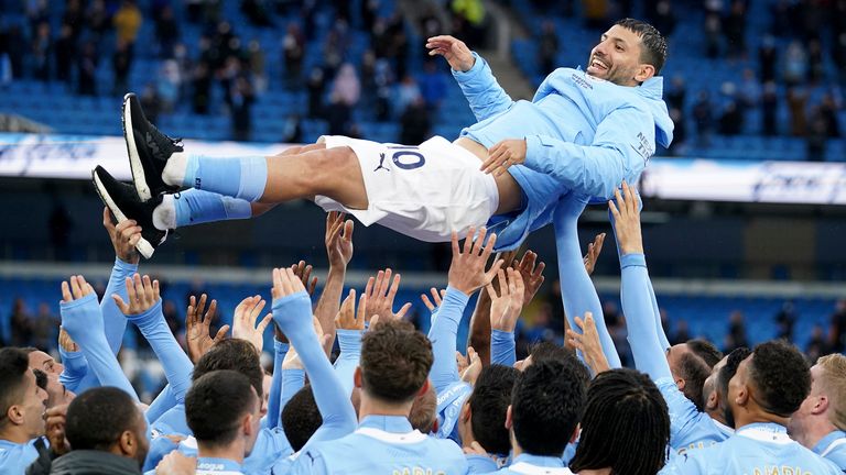Sergio Aguero is thrown up in the air by his Man City teammates (AP)