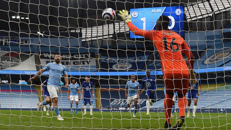 Chelsea&#39;s goalkeeper Edouard Mendy saves a penalty shot by Manchester City&#39;s Sergio Aguero, left, during the English Premier League soccer match between Manchester City and Chelsea at the Etihad Stadium in Manchester, Saturday, May 8, 2021.