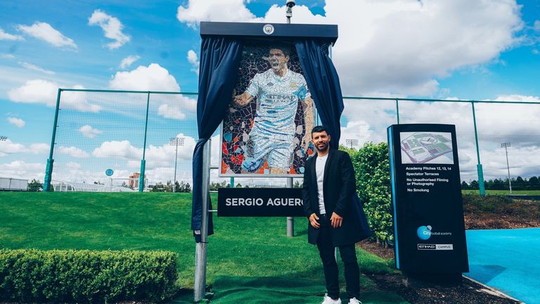 Sergio Aguero has been presented with a mosaic outside the Manchester City Football Academy inspired by his first goal for the club against Swansea City in 2011 

