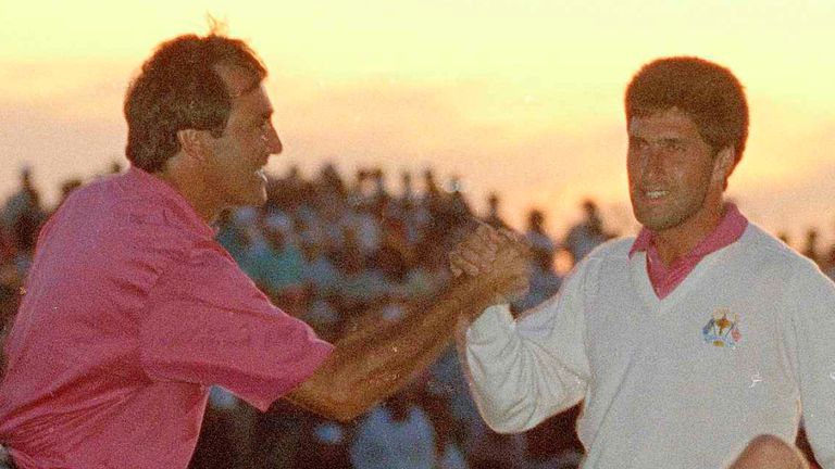 European Ryder Cup teammates Seve Ballesteros, left, and Jose Maria Olazabal, right, congratulate each other after they won their 4th match of the Ryder Cup by defeating the U.S. team of Payne Stewart and Fred Couples on Kiawah Island, S.C., Sept. 28, 1991. Payne Stewart is at lower right. (AP Photo/Charles Rex Arbogast)