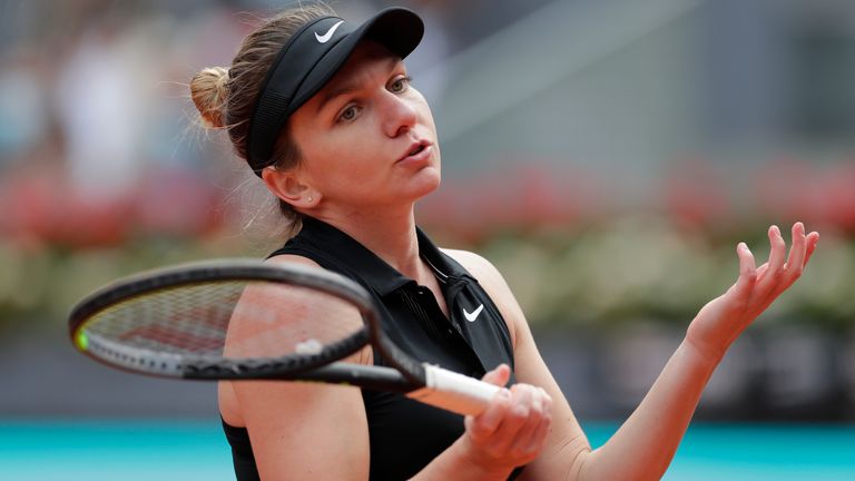 Simona Halep of Rumania reacts during her match against Saisai Zheng of China at the Madrid Open tennis tournament in Madrid, Spain, Sunday, May 2, 2021. (AP Photo/Paul White)