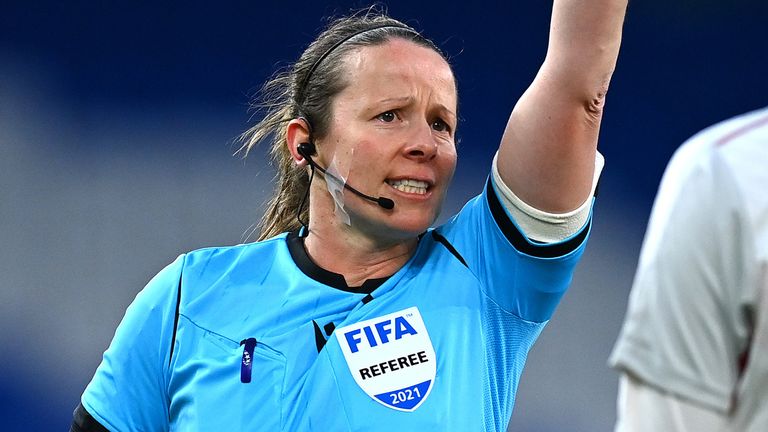 CARDIFF, WALES - APRIL 13: Referee, Stacey Pearson gives Nicoline Sorensen of Denmark a yellow card during the Women's International Friendly match between Wales and Denmark at Cardiff City Stadium on April 13, 2021 in Cardiff, Wales. Sporting stadiums around the UK remain under strict restrictions due to the Coronavirus Pandemic as Government social distancing laws prohibit fans inside venues resulting in games being played behind closed doors. (Photo by Dan Mullan/Getty Images)